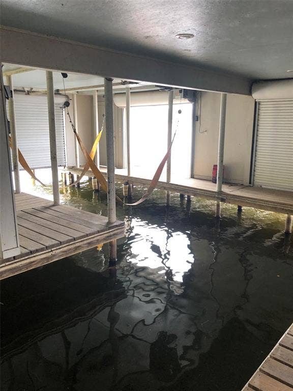 5449 Impala Point Drive, Athens, TX 75752 Boat house with lift and plenty of room to park your boat and lake toys!