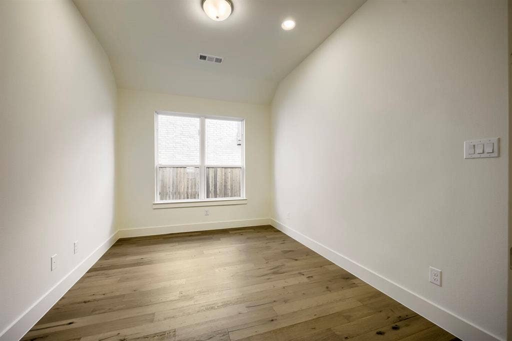690 Red Cedar Road, Haslet, TX 76052 Wood-finish flooring, recessed lighting, and a flush mount ceiling fixture illuminate this space with a single window