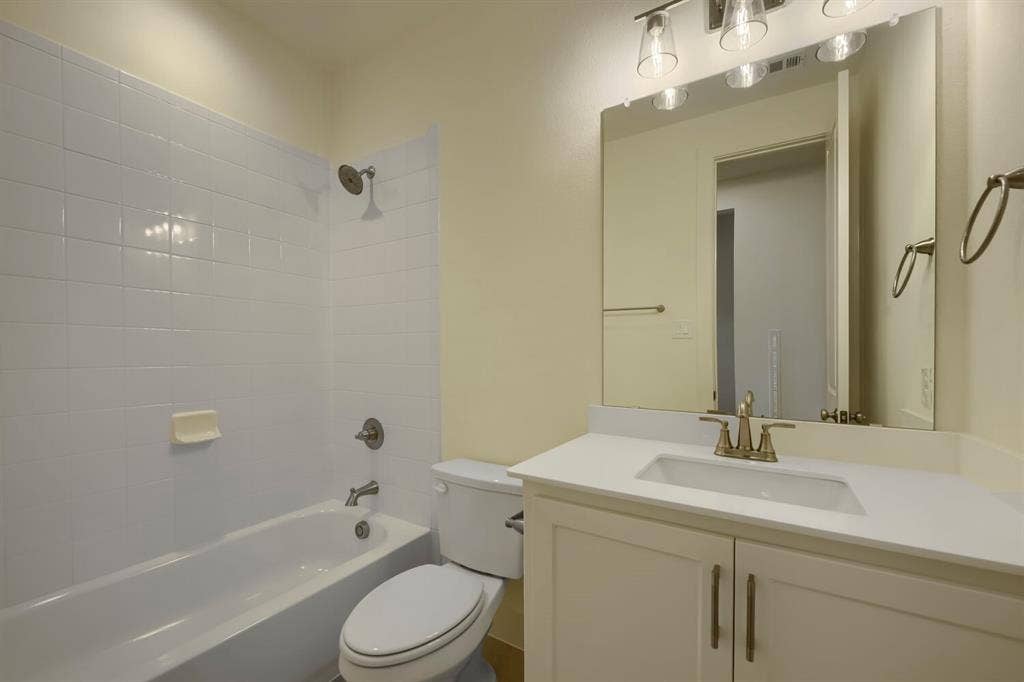 690 Red Cedar Road, Haslet, TX 76052 White subway tile shower surround with a built-in bathtub
