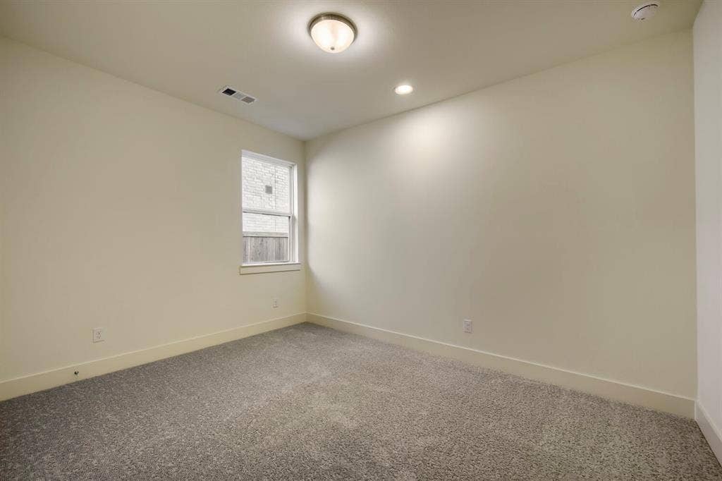 690 Red Cedar Road, Haslet, TX 76052 Recessed lighting, wall-mounted light fixture, neutral wall color, single window, and carpeted flooring