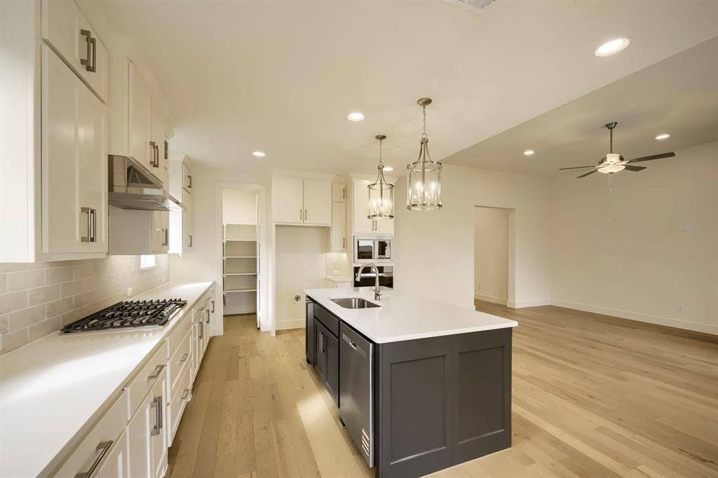 690 Red Cedar Road, Haslet, TX 76052 White cabinetry and light wood-finish flooring