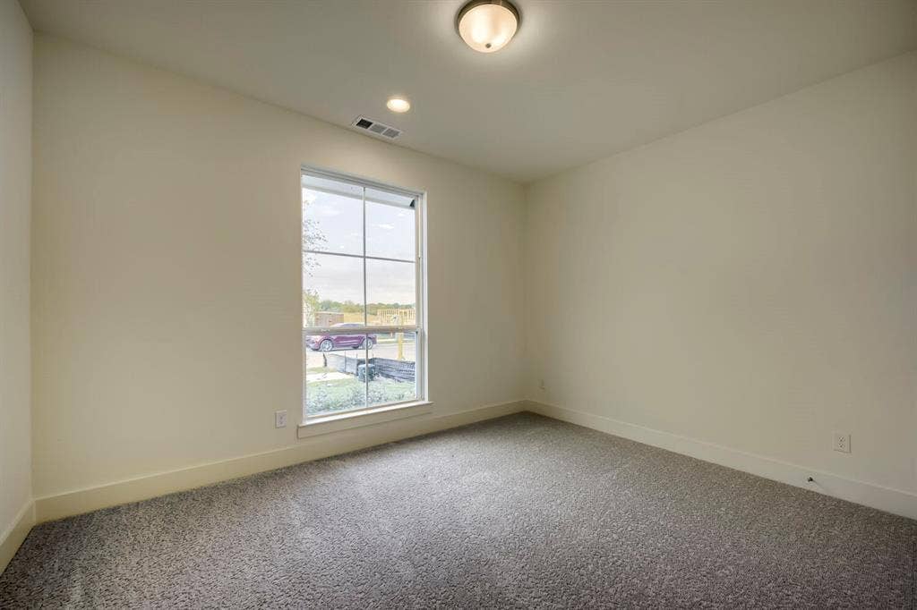 690 Red Cedar Road, Haslet, TX 76052 Neutral wall paint, recessed lighting, and a single ceiling fixture