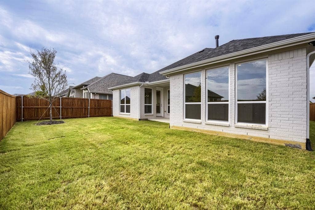 690 Red Cedar Road, Haslet, TX 76052 Expansive grass lawn with a wood privacy fence