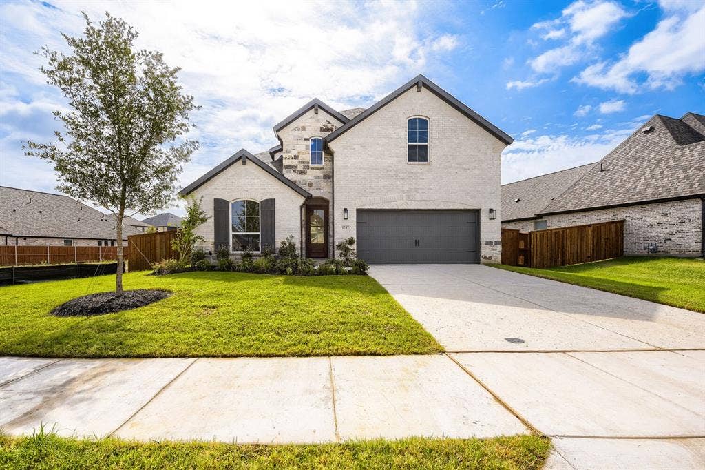 1281 White Pine Drive, Haslet, TX 76052 Stone and brick facade with dark shutters, front-facing two-car garage, and a concrete driveway