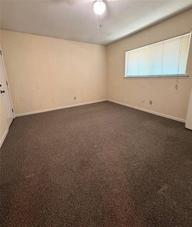 5106 Reiger Avenue, Dallas, TX 75214 Interior space featuring neutral wall tones, wall-to-wall carpeting, horizontal window blinds, and a ceiling-mounted light fixture