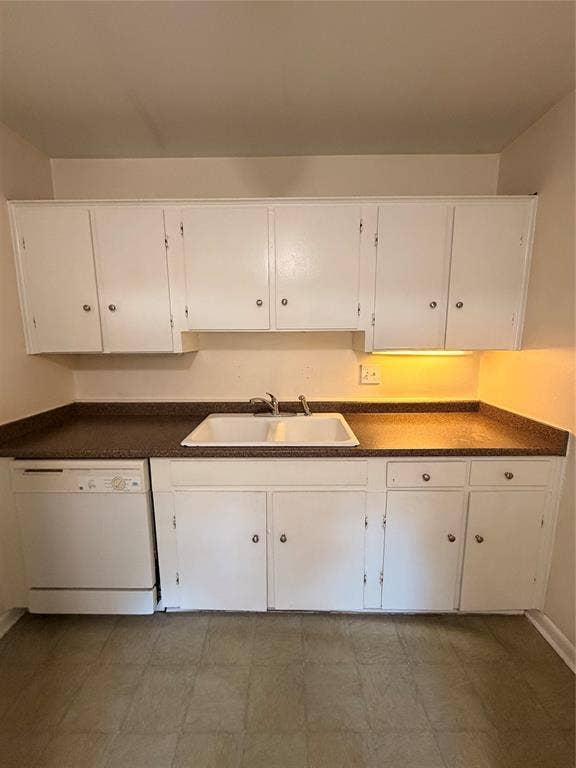 5106 Reiger Avenue, Dallas, TX 75214 Kitchen featuring white cabinetry, solid-surface countertops, dual-basin sink with metallic faucet, and built-in dishwasher