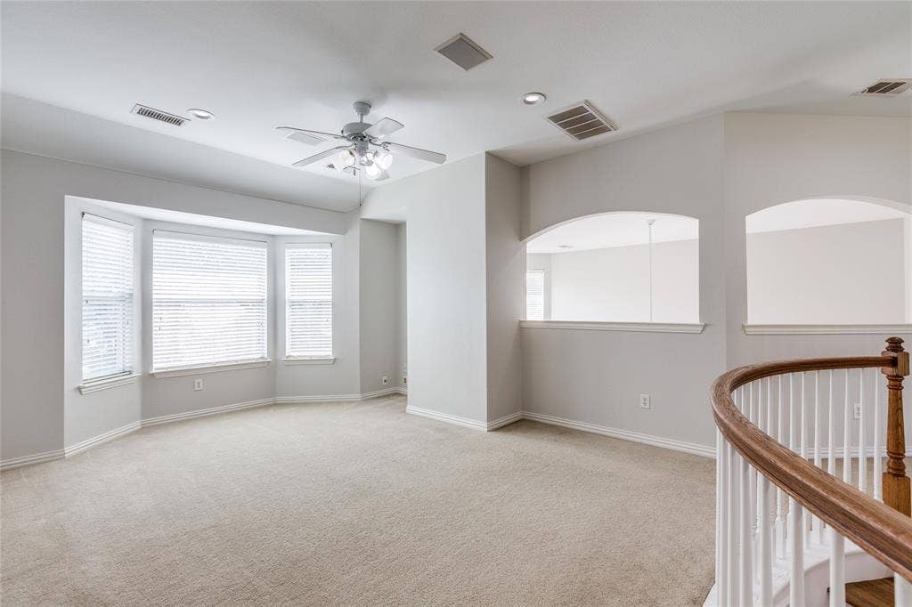 3401 Maddock Drive, McKinney, TX 75070 Spacious upper-level room featuring pristine beige carpet, recessed ceiling lighting, and a ceiling fan