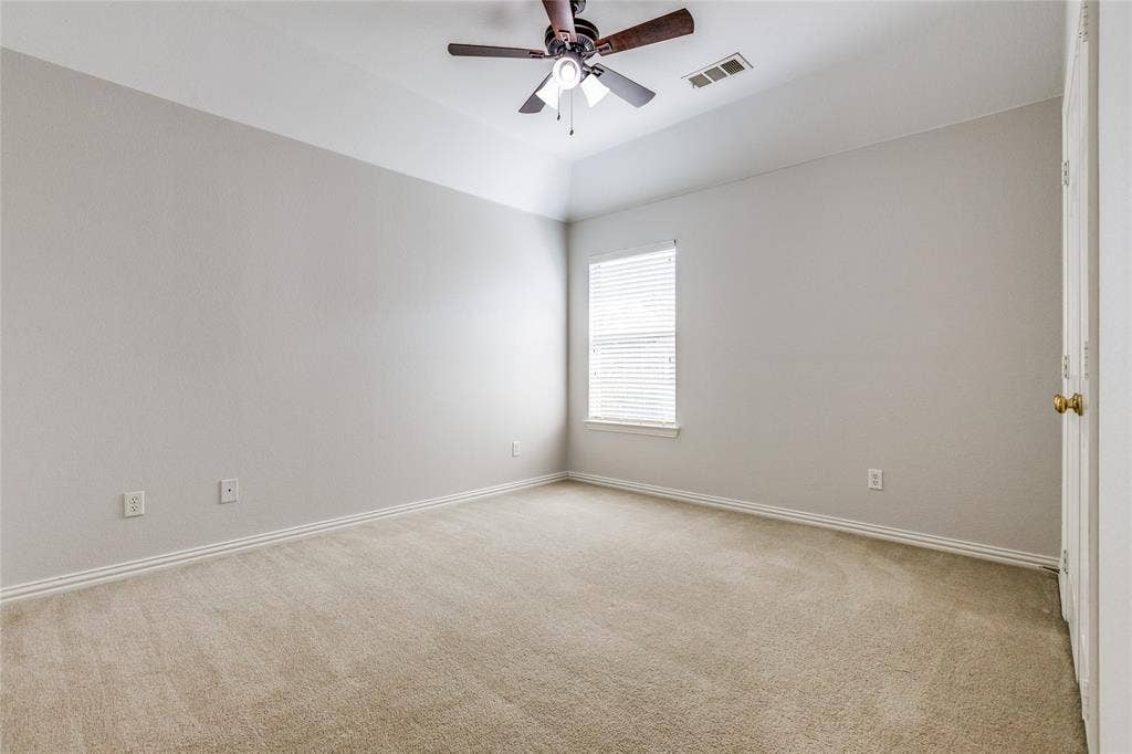 3401 Maddock Drive, McKinney, TX 75070 Room featuring light-toned carpeting, neutral wall paint, and white baseboards