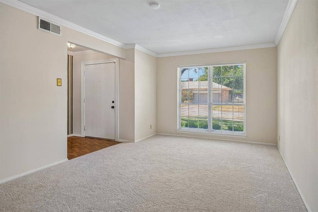 902 N Lindale Lane, Richardson, TX 75080 Light flows into the front living area, ideal for those larger gatherings.