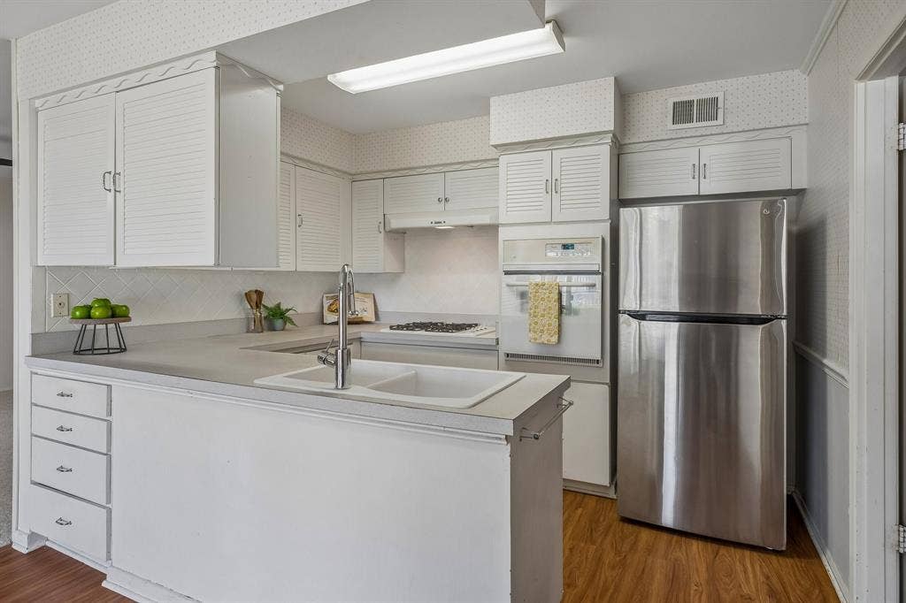 902 N Lindale Lane, Richardson, TX 75080 Natural light floods the kitchen and dining areas.