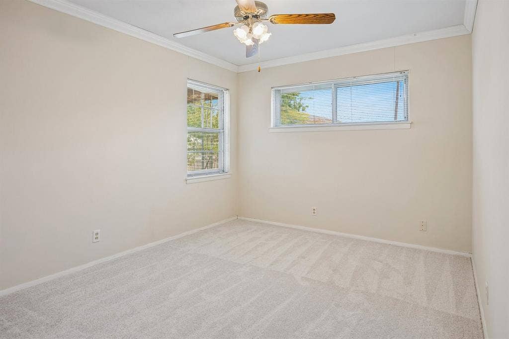 902 N Lindale Lane, Richardson, TX 75080 Abundant natural light and crown molding accompany each of the 4 bedrooms.