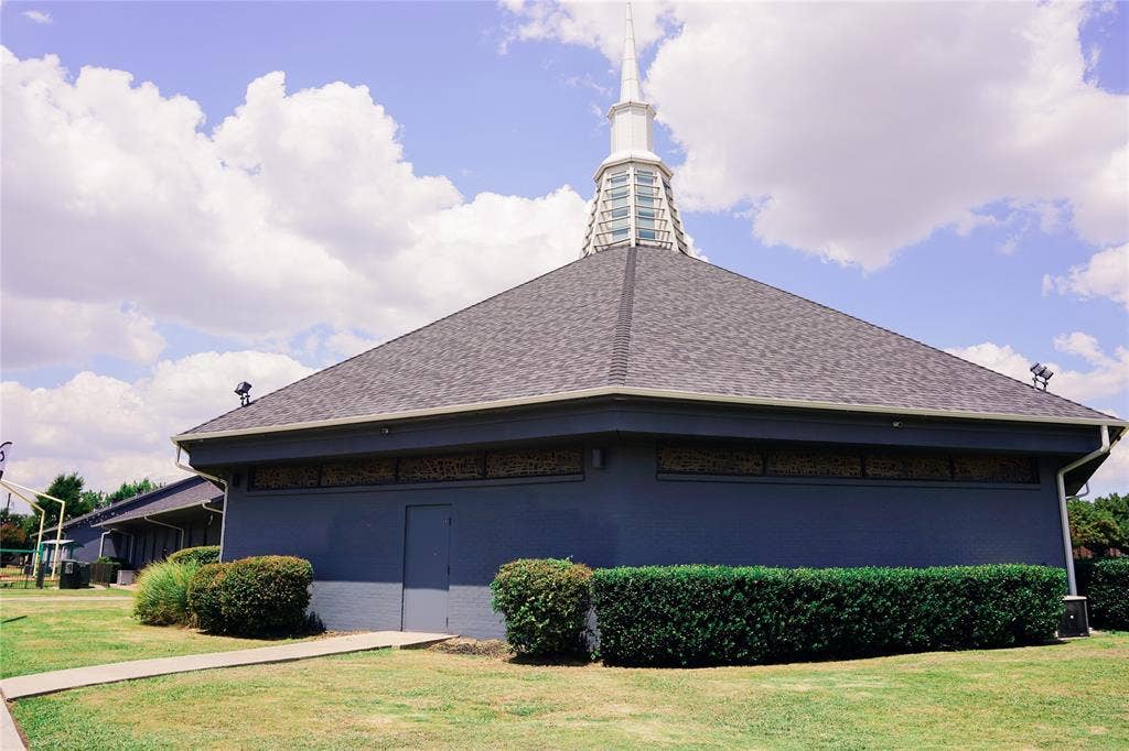 2705 Virginia Parkway, McKinney, TX 75071 Modern circular architectural design featuring a distinctive domed roof with cupola and spire, complemented by a charcoal gray exterior finish