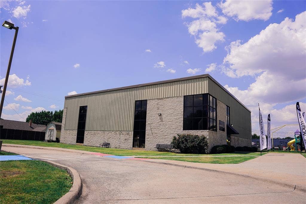 2705 Virginia Parkway, McKinney, TX 75071 Commercial building featuring a stone block and corrugated metal exterior