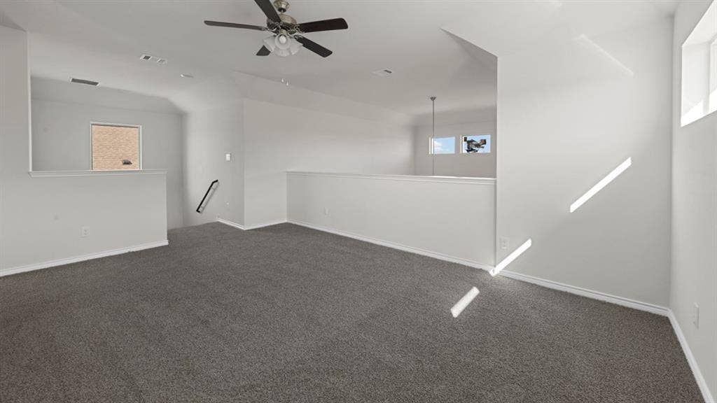 8425 Everly Drive, Garland, TX 75043 Open loft area featuring gray carpet flooring and white walls