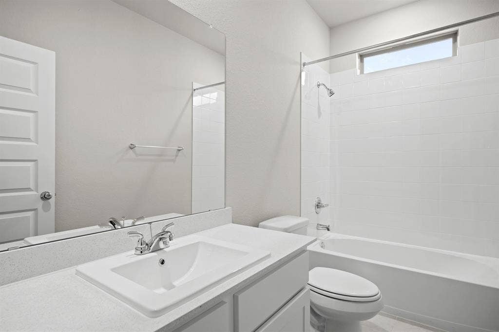 341 Millwood Road, Lavon, TX 75166 Bathroom in the Birch home plan by Trophy Signature Homes – REPRESENTATIVE PHOTO