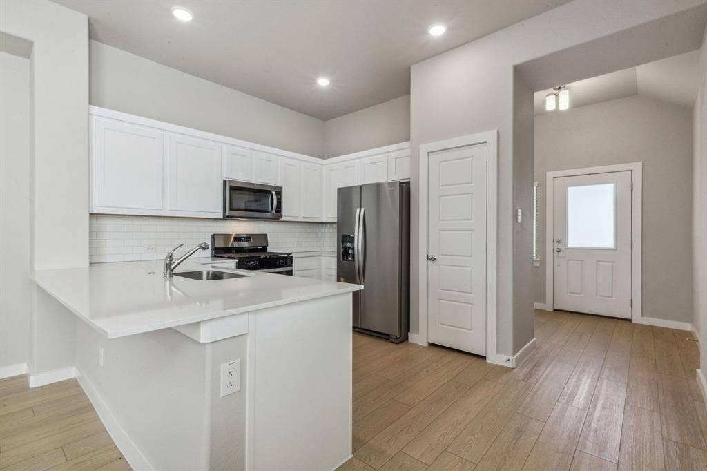 341 Millwood Road, Lavon, TX 75166 Kitchen in the Birch home plan by Trophy Signature Homes – REPRESENTATIVE PHOTO