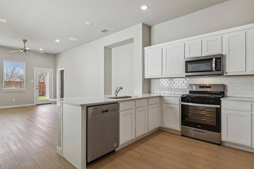 341 Millwood Road, Lavon, TX 75166 Kitchen in the Birch home plan by Trophy Signature Homes – REPRESENTATIVE PHOTO