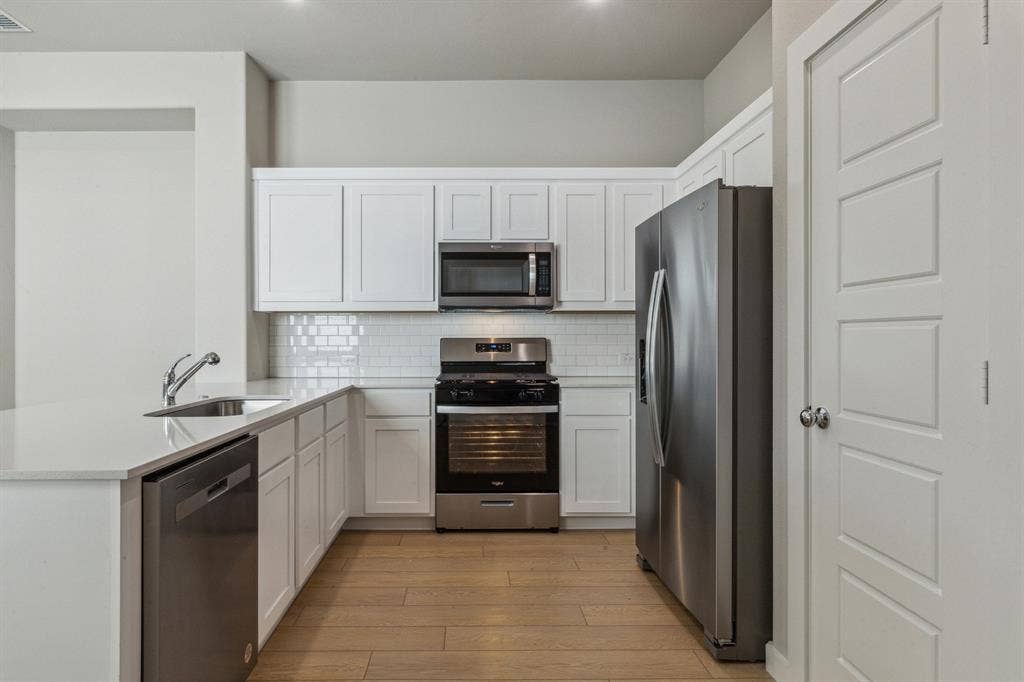 341 Millwood Road, Lavon, TX 75166 Kitchen in the Birch home plan by Trophy Signature Homes – REPRESENTATIVE PHOTO