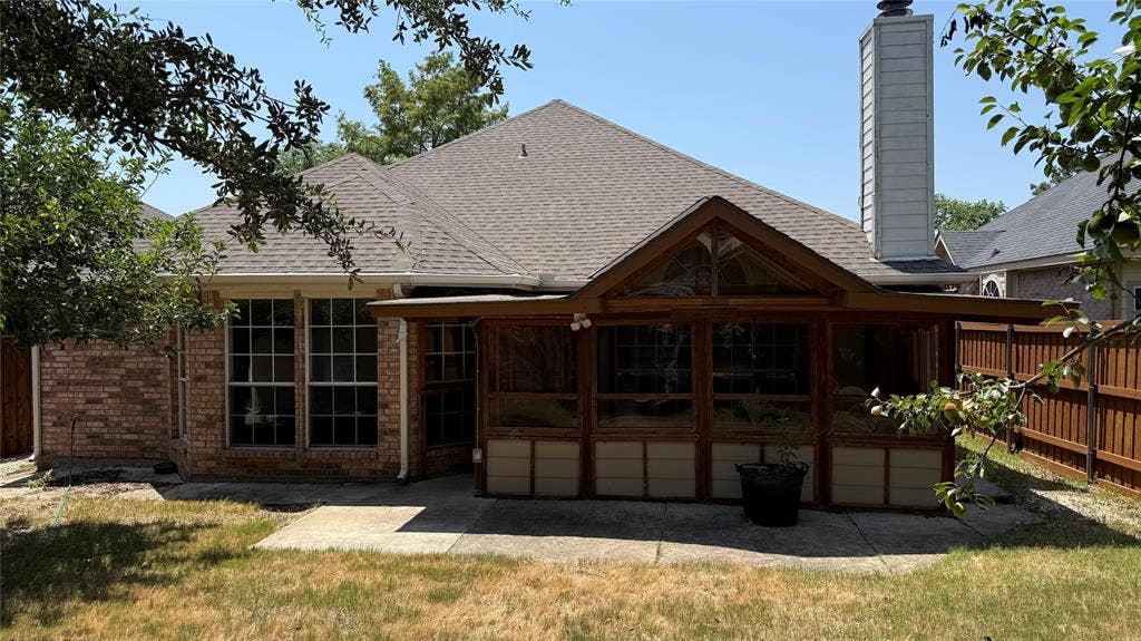 3312 Woodberry Lane, McKinney, TX 75071 Elegant brick exterior with a gabled roofline and substantial covered porch featuring multiple French doors and windows