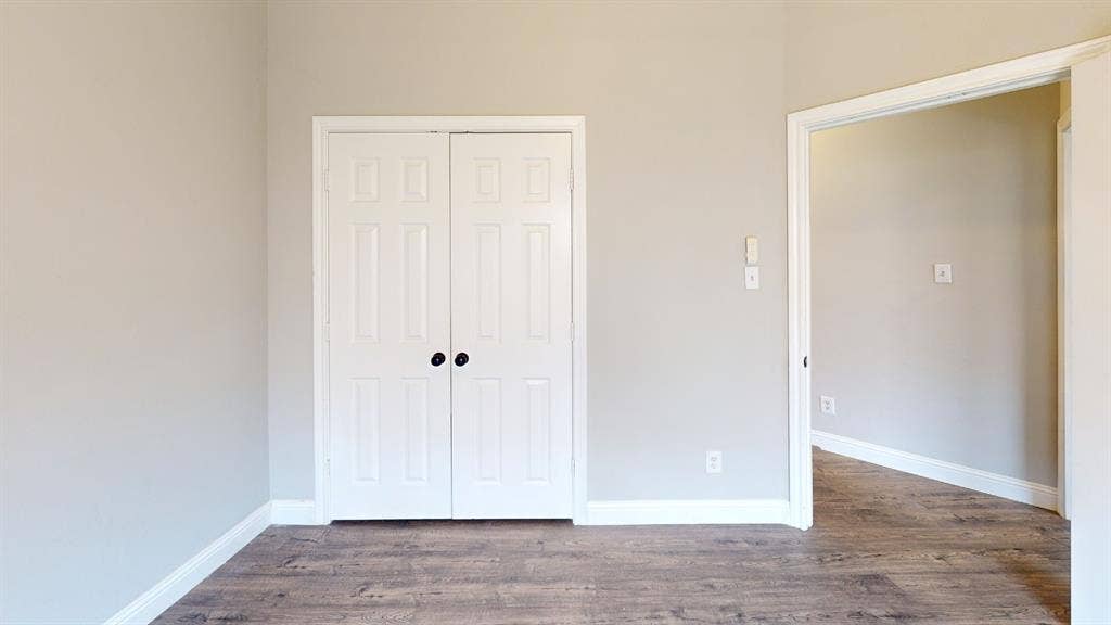 3312 Woodberry Lane, McKinney, TX 75071 Interior room featuring wood-finish flooring and light-toned walls