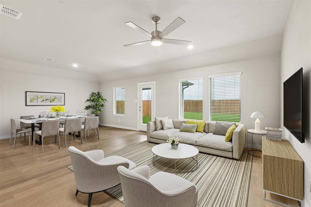 2214 Willowbank Drive, Forney, TX 75126 Living Room in the Emmy II home plan by Trophy Signature Homes - REPRESENTATIVE PHOTO