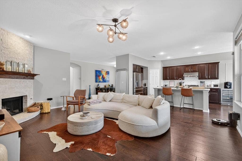 Open-concept living space featuring wood-finish flooring throughout