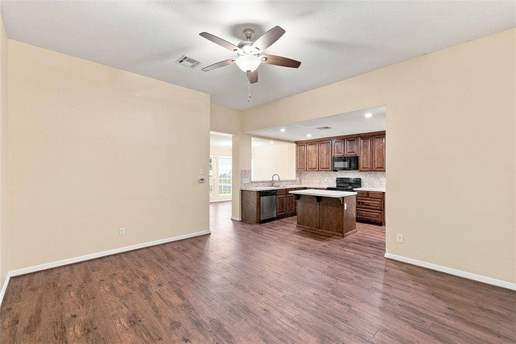 204 Raven Ridge Court, Lacy Lakeview, TX 76705 Wood-finish flooring throughout, with a ceiling fan in the foreground