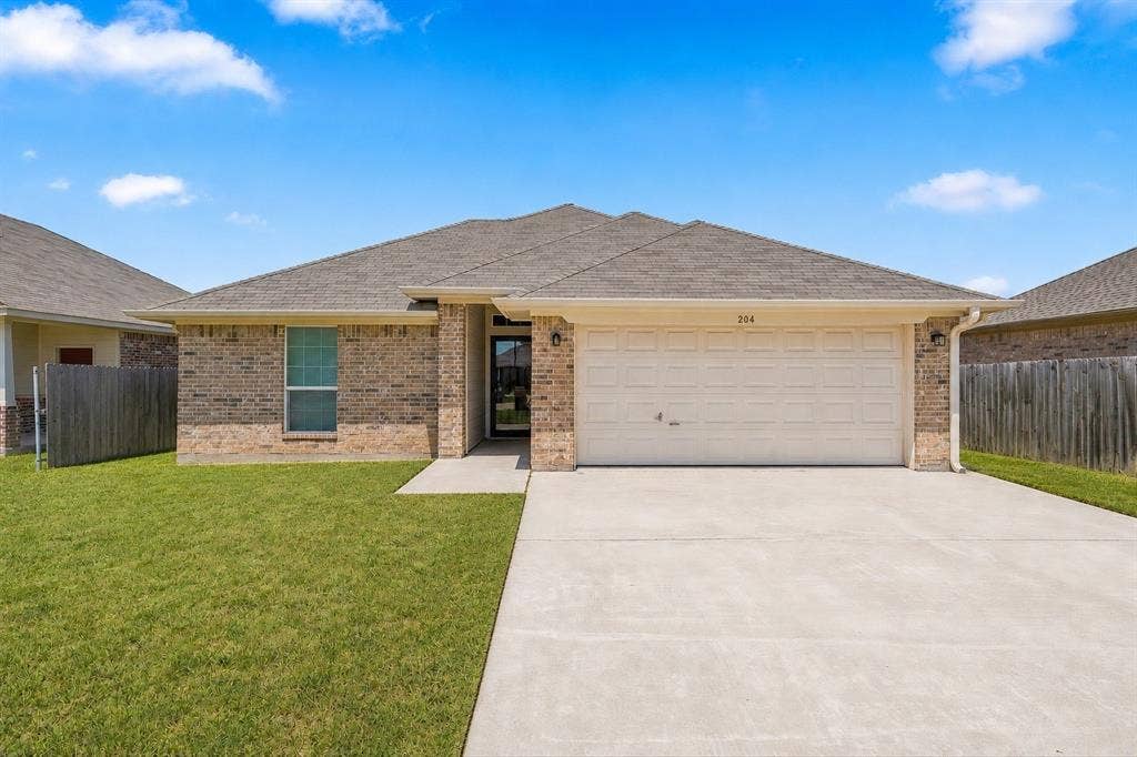 204 Raven Ridge Court, Lacy Lakeview, TX 76705 Virtual rendering. Brick exterior with a gabled roof and attached garage