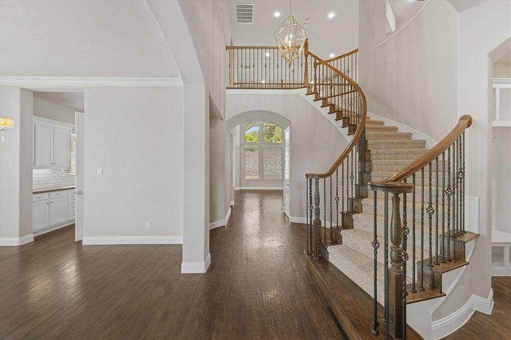 10846 Smoky Oak Trail, Argyle, TX 76226 The home features fresh paint throughout on every surface of the 4,971 sq ft home! (walls, ceiling, doors, trim, baseboards, molding, cabinets, etc) It shines like new! This entire home has been refreshed with even new carpet on the upper level too! First floor showcases hand scraped hardwood floors. Kitchen features built in SS appliances, a gas cooktop, tons of storage, granite and quartz countertops, a deep farmhouse sink, gorgeous lighting fixtures, an island with room for barstools, eat in kitchen, open floor plan, and more!