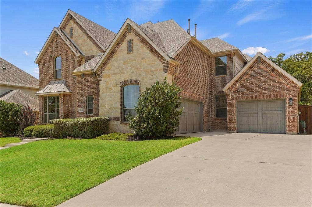 10846 Smoky Oak Trail, Argyle, TX 76226 This gorgeous almost 5,000 sqft home features a 3 car garage, a gorgeous brick and stone elevation, over a quarter acre lot that backs up to a quiet greenbelt for extra privacy, and the perfect layout with two of the five bedrooms on the first floor, as well as a dedicated office!