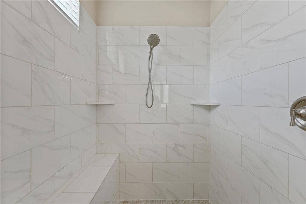 10846 Smoky Oak Trail, Argyle, TX 76226 The primary bedroom is located on the first floor and has a perfect split floorplan with the other bedroom in the mother in law wing. Both feature an ensute bath. The main primary bath is huge! It features a nice tile walk in shower, a large garden soaking tub, and separte vanities as well as a gigantic walk in closet.
