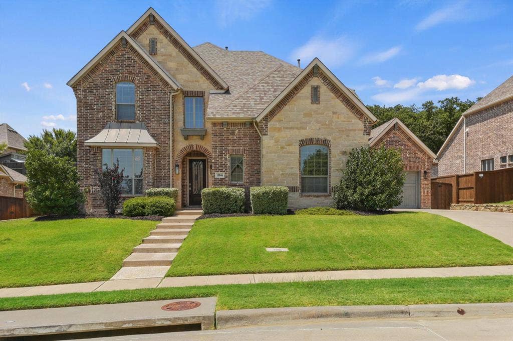 10846 Smoky Oak Trail, Argyle, TX 76226 This gorgeous almost 5,000 sqft home features a 3 car garage, a gorgeous brick and stone elevation, over a quarter acre lot that backs up to a quiet greenbelt for extra privacy, and the perfect layout with two of the five bedrooms on the first floor, as well as a dedicated office!