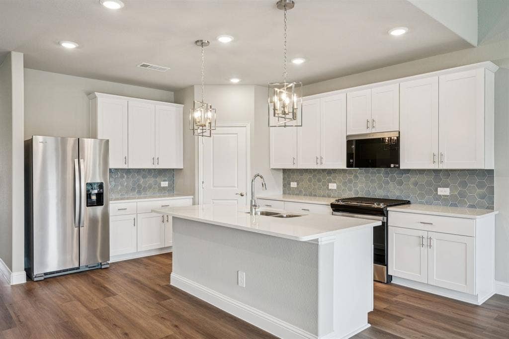 6202 Chickney Drive, Princeton, TX 75071 Photo is not of the actual home, but is an inspirational photo of builder’s model home and may depict options, furnishings, and/or decorator features that are not included.