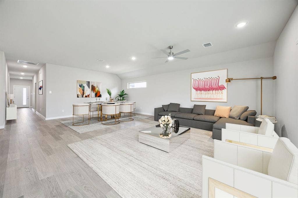 Dining and Living Room in the Hayden home plan by Trophy Signature Homes – REPRESENTATIVE PHOTO