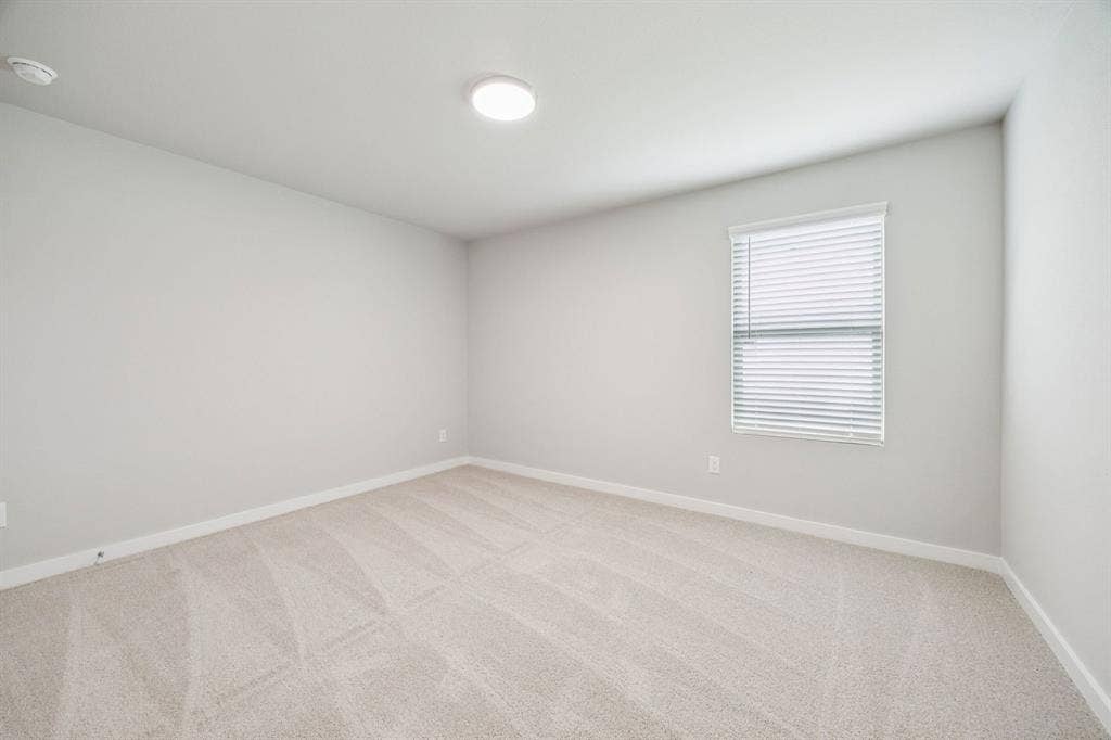 Bedroom in the Hayden home plan by Trophy Signature Homes – REPRESENTATIVE PHOTO