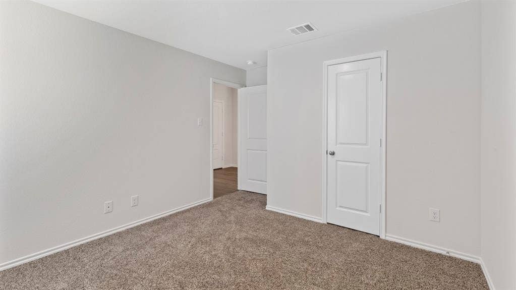 401 Banner Avenue, Royse City, TX 75189 Carpeted room with light neutral walls and white trim