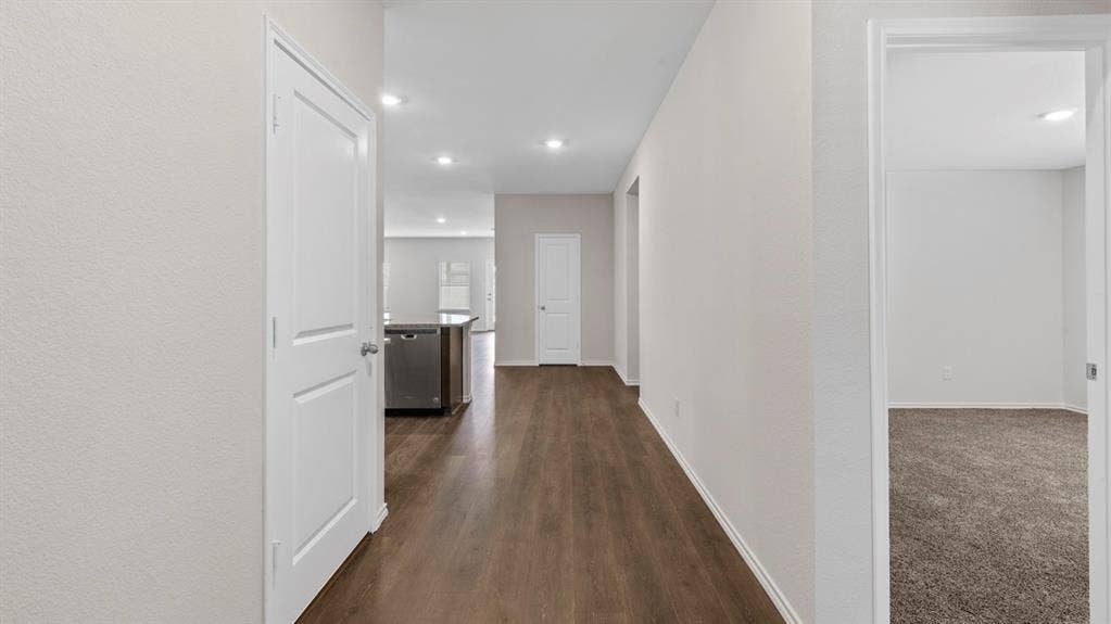 401 Banner Avenue, Royse City, TX 75189 Hallway featuring wood-finish flooring, recessed lighting, and neutral wall tones