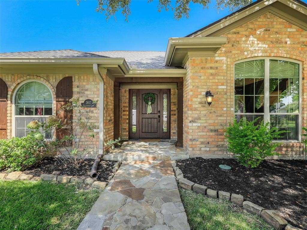 3617 Hackamore Court, Plano, TX 75023 Elegant flagstone walk greets you on this beautiful entry.