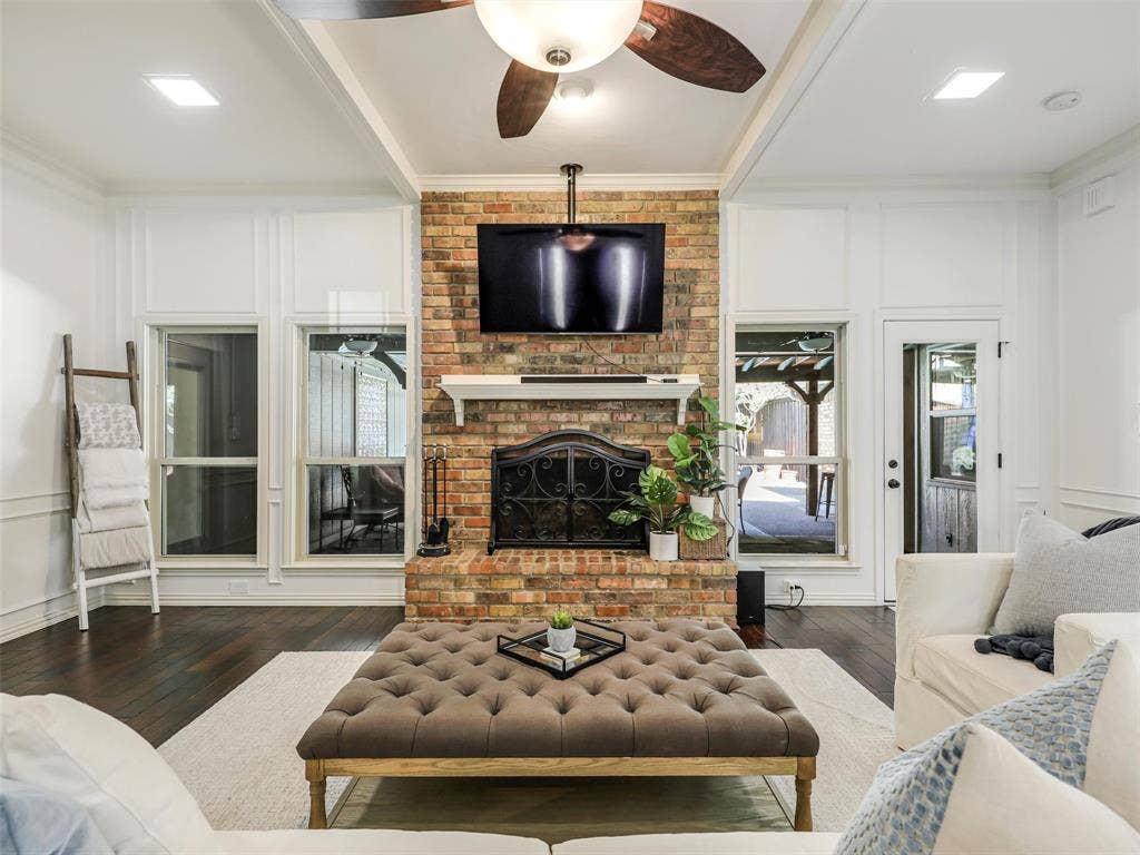 3617 Hackamore Court, Plano, TX 75023 Exposed brick fireplace with a decorative mantel and hearth. Imagine your gatherings!