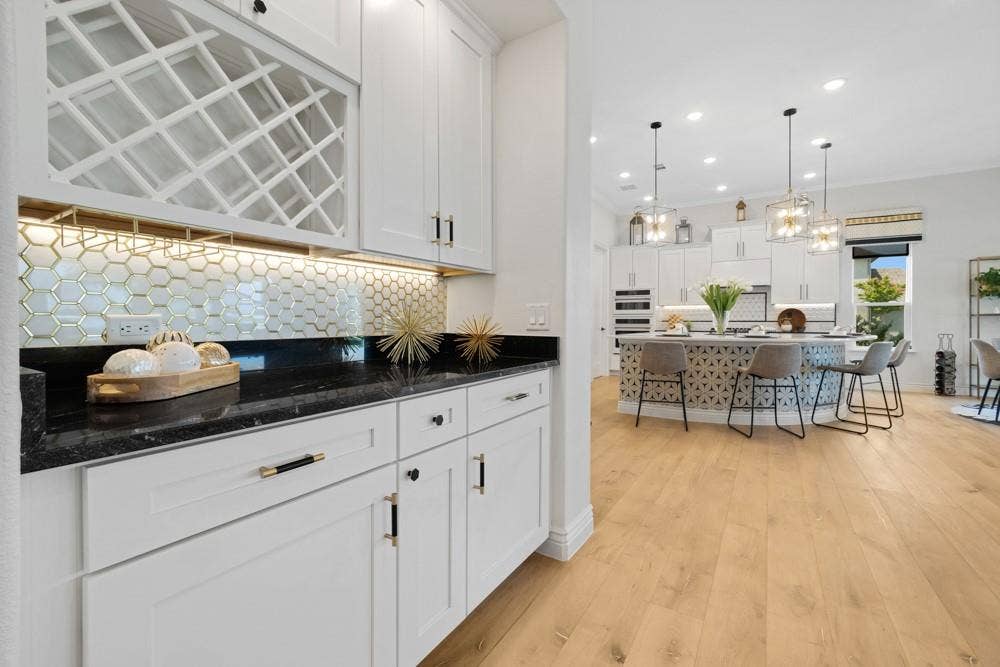 Dry Bar has Granite Countertop and Stylish Backsplash