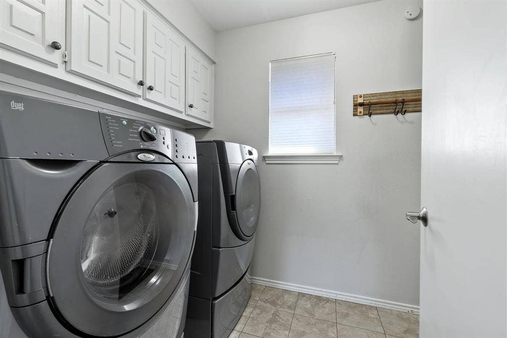 6803 Fernshaw Drive, Dallas, TX 75248 White upper cabinetry with dark hardware