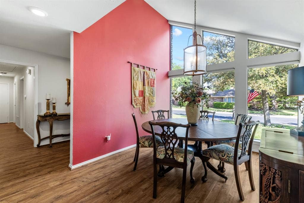 6803 Fernshaw Drive, Dallas, TX 75248 Vaulted ceilings, expansive window wall, wood-finish flooring, recessed lighting, and a decorative pendant light fixture