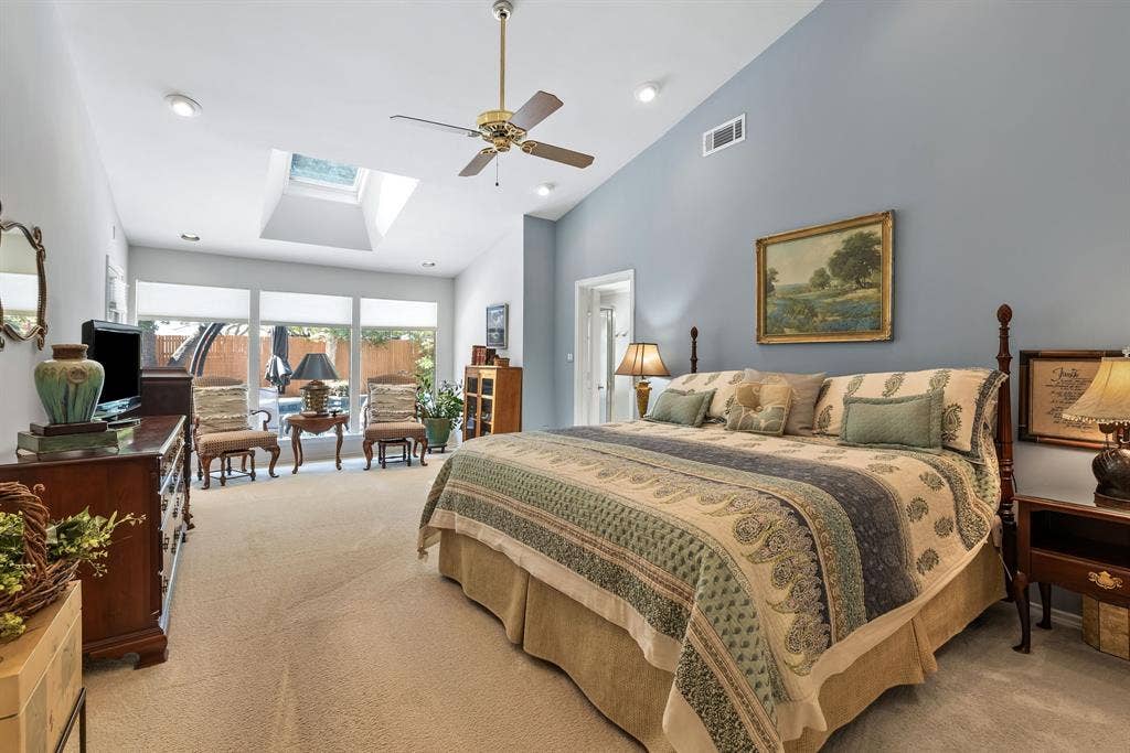 6803 Fernshaw Drive, Dallas, TX 75248 Vaulted ceiling with recessed lighting, skylight, ceiling fan, and expansive windows