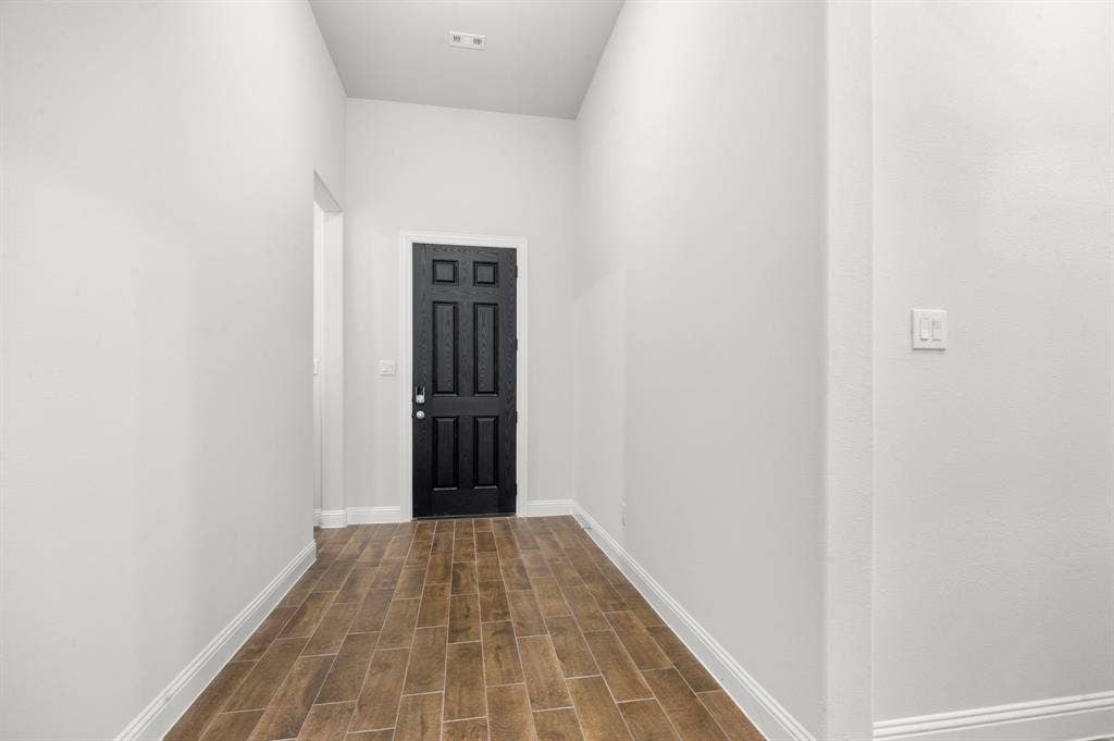 16050 Talamore Lane, Frisco, TX 75035 Entryway with dark hardwood / wood-style floors