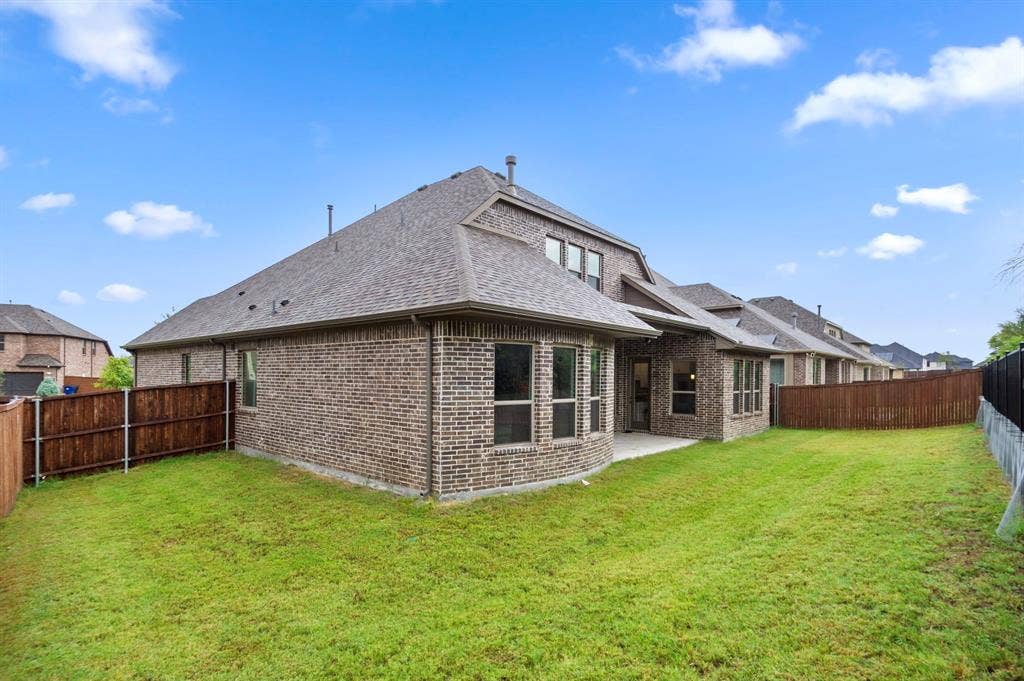 16050 Talamore Lane, Frisco, TX 75035 Rear view of property featuring a patio area and a yard