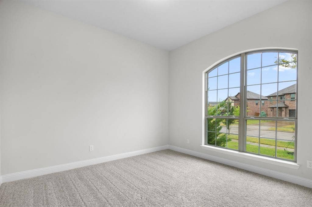 16050 Talamore Lane, Frisco, TX 75035 Carpeted spare room with plenty of natural light