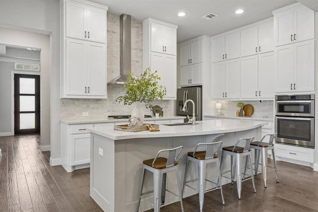 1107 Maverick Drive, Allen, TX 75013 Kitchen with double stacked cabinets, upgraded backsplash and vent hood
