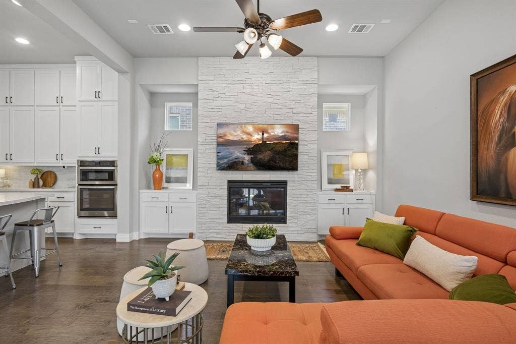 1107 Maverick Drive, Allen, TX 75013 Large family room with fireplace and built in cabinets