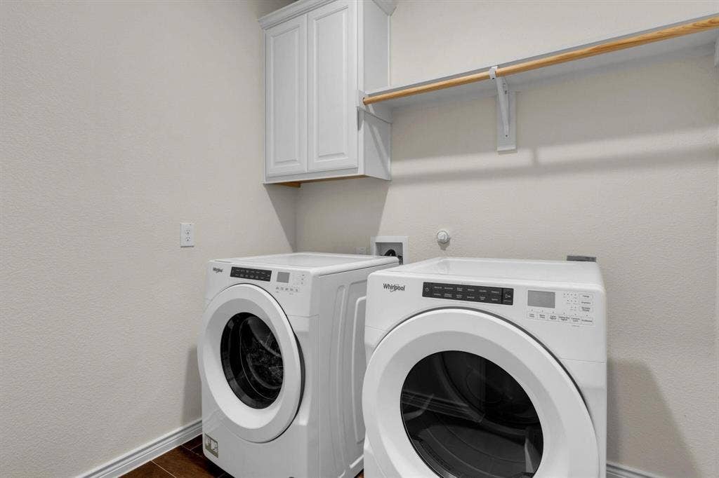 3106 Maverick Drive, Heath, TX 75126 Dedicated laundry space featuring wood-finish flooring and a neutral wall color