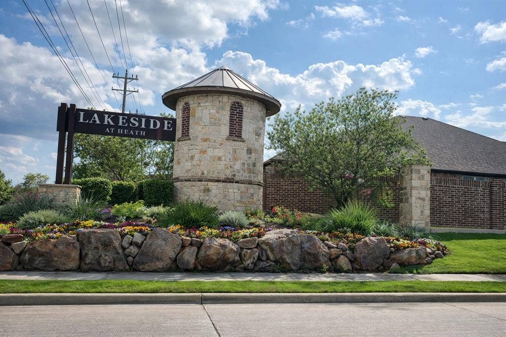 3106 Maverick Drive, Heath, TX 75126 Stone and brick entry monument featuring a turret-style architectural element
